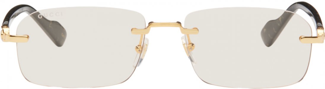 Золотисто-черные солнцезащитные очки без оправы Gucci