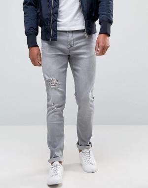 Серые зауженные джинсы с прорехами Hoxton Denim. Цвет: серый
