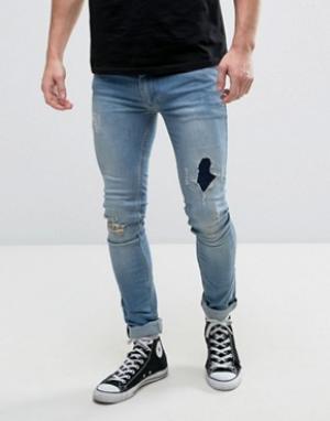 Эластичные супероблегающие джинсы с заплатками Religion. Цвет: синий