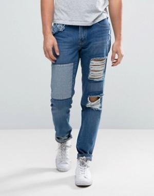 Зауженные джинсы с рваной отделкой и заплатками Waven. Цвет: синий