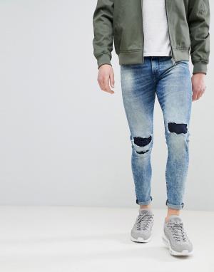 Супероблегающие джинсы с дырками и заплатками на коленях Good For Nothing. Цвет: синий