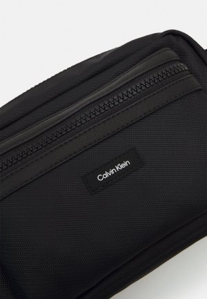 Сумка через плечо CK ESSENTIAL CAMERA BAG , цвет black Calvin Klein
