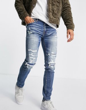 Выбеленные зауженные джинсы с рваной отделкой и заплатками -Голубой American Eagle