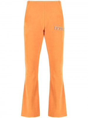 Расклешенные велюровые брюки с логотипом Fiorucci. Цвет: оранжевый