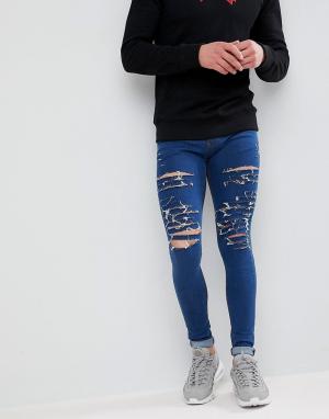 Рваные супероблегающие джинсы Criminal Damage. Цвет: синий