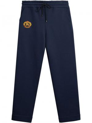 Спортивные брюки с вышивкой винтажного герба Burberry. Цвет: синий