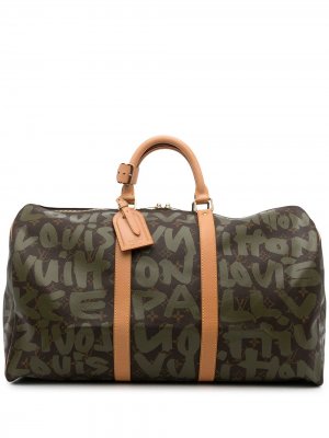 Дорожная сумка Keepall 50 2001-го года из коллаборации со Stephen Sprouse Louis Vuitton. Цвет: зеленый