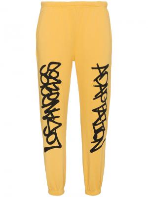 Спортивные брюки Graffiti Adaptation. Цвет: жёлтый и оранжевый
